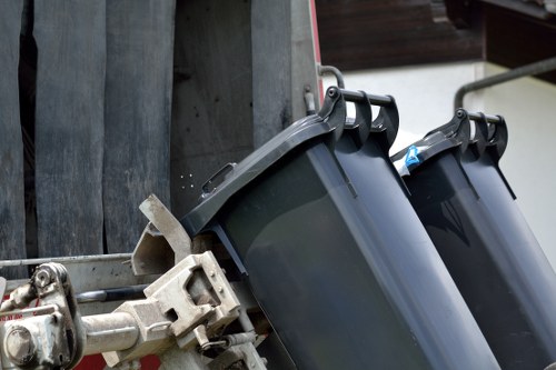 Waste management workers handling bins